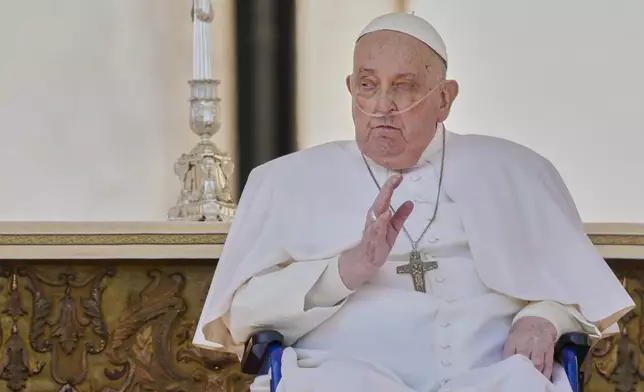 FILE - Pope Francis arrives in a wheelchair at the end of a mass in St. Peter's Square, part of the Jubilee of the sick and the health workers, at the Vatican, Sunday, April 6, 2025. (AP Photo/Andrew Medichini, file)