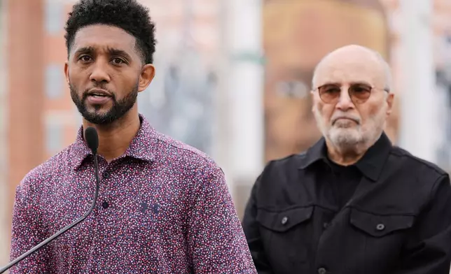 Baltimore Mayor Brandon Scott, left, accompanied by attorney William H. "Billy" Murphy, Jr., speaks at a memorial event commemorating the ten-year anniversary of the death of Freddie Gray, Saturday, April 19, 2025, in Baltimore. (AP Photo/Stephanie Scarbrough)