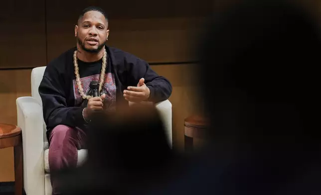 Dayvon Love, director of public policy for Leaders of a Beautiful Struggle, speaks during a panel discussion, Thursday, April 10, 2025, in Baltimore. (AP Photo/Stephanie Scarbrough)