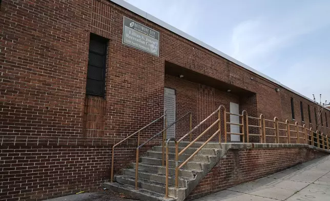 A sign on the Lillian S. Jones Recreation Center remains despite the center being closed since 20121, as seen in the Sandtown-Winchester neighborhood in Baltimore, Monday, April 14, 2025. (AP Photo/Stephanie Scarbrough)
