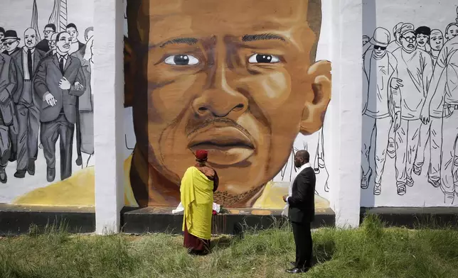 FILE - A mural depicts Freddie Gray, who died from spinal injuries sustained during transport in a Baltimore police van, in Baltimore, May 7, 2015. (AP Photo/Patrick Semansky, File)