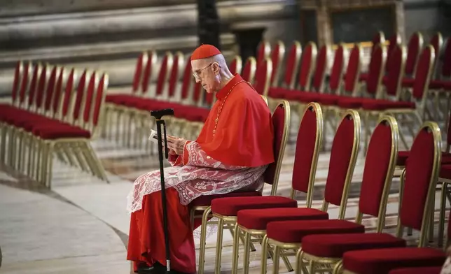 Cardinal Tarcisio Bertone sits in St. Peter's Basilica ahead of the arrival of the body of Pope Francis, who will lie in state for three days, at the Vatican, Wednesday, April 23, 2025. (AP Photo/Alessandra Tarantino)