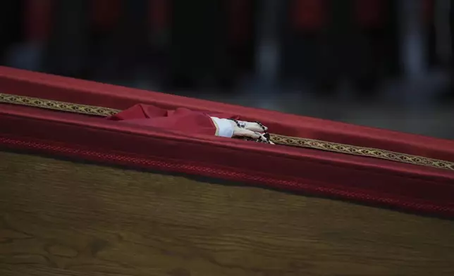 The body of Pope Francis inside St. Peter's Basilica at the Vatican, Wednesday, April 23, 2025, where he will lie in state for three days. (AP Photo/Alessandra Tarantino)