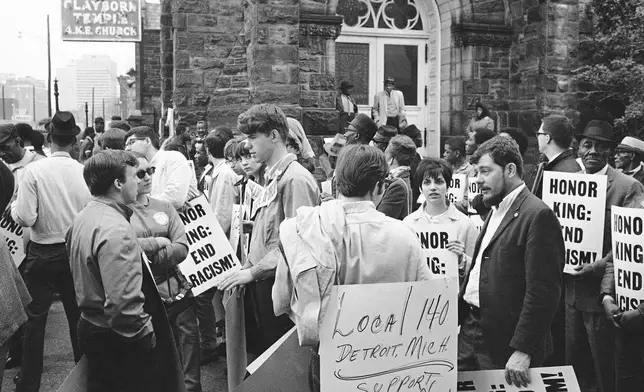 FILE - In this April 8, 1968, file photo, people gather at the Clayborn Temple as they prepare to march in honor of Dr. Martin Luther King in Memphis, Tenn., four days after the civil rights leader was assassinated. (AP Photo/File)