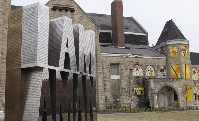 FILE - A bronze and steel sculpture honoring a sanitation workers strike that brought the Rev. Martin Luther King Jr. to Memphis in 1968 was dedicated on April 5, 2018, in Memphis, Tenn. The memorial sits next to the Clayborn Temple, which served as the headquarters of the strike. (AP Photo/Adrian Sainz)