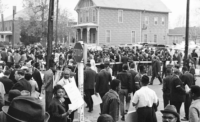 FILE - People gather at the Clayborn Temple as they prepare to march in honor of Dr. Martin Luther King in Memphis, Tenn., on April 8, 1968, four days after the civil rights leader was assassinated. (AP Photo/File)