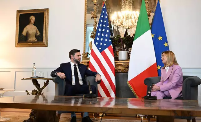 U.S. Vice President JD Vance meets with Italian Prime Minister Giorgia Meloni at Chigi Palace in Rome, Italy, Friday April 18, 2025. (Kenny Holston/The New York Times via AP, Pool)