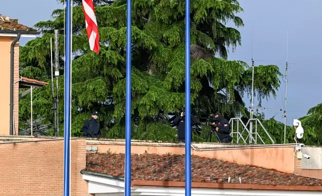 Italian government officials look on as Vice President JD Vance and family arrive at G. B. Pastine–Rome Ciampino Airport, onboard Air Force Two, Friday April 18, 2025. (Kenny Holston/The New York Times via AP, Pool)