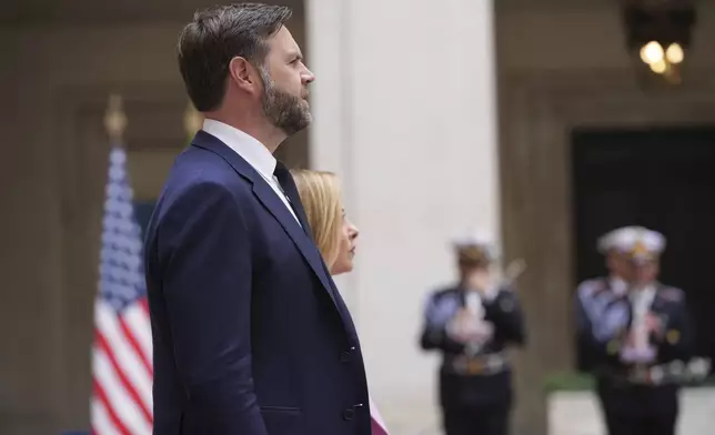 U.S. Vice President JD Vance, left, listens to national anthems with Italian Premier Giorgia Meloni as he arrives for talks at Palazzo Chigi government office in Rome, Friday, April 18, 2025. (AP Photo/Andrew Medichini)
