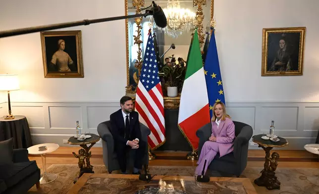 U.S. Vice President JD Vance meets with Italian Prime Minister Giorgia Meloni at Chigi Palace in Rome, Italy, Friday April 18, 2025. (Kenny Holston/The New York Times via AP, Pool)