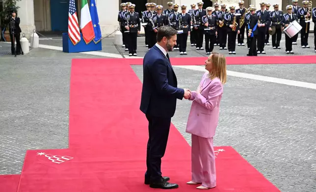 U.S. Vice President JD Vance meets with Italian Prime Minister Giorgia Meloni at Chigi Palace in Rome, Italy, Friday April 18, 2025. (Kenny Holston/The New York Times via AP, Pool)