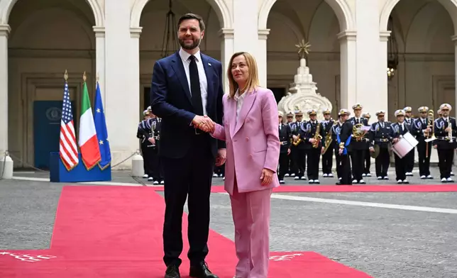 U.S. Vice President JD Vance meets with Italian Prime Minister Giorgia Meloni at Chigi Palace in Rome, Italy, Friday April 18, 2025. (Kenny Holston/The New York Times via AP, Pool)