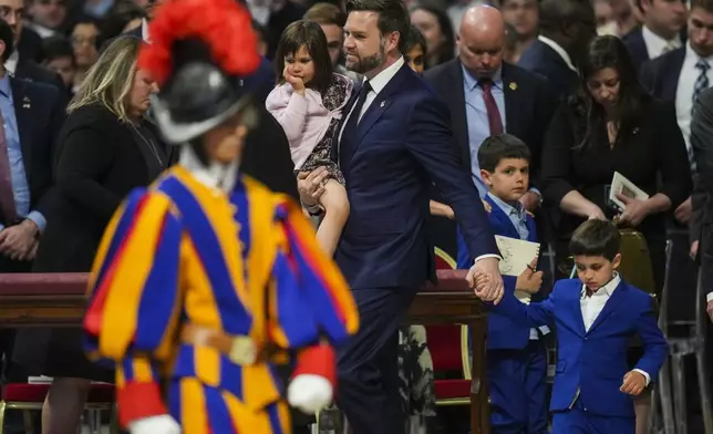 U.S. Vice President JD Vance, with, from left, daughter Mirabel, sons Ewan and Vivek leave at the end of a Good Friday service inside St. Peter's Basilica at the Vatican, Friday, April 18, 2025. (AP Photo/Alessandra Tarantino)