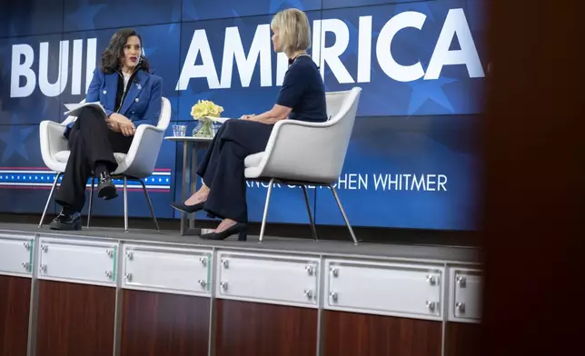 Michigan Gov. Gretchen Whitmer speaks with former television journalist Gretchen Carlson at an event on Wednesday, April 9, 2025, in Washington. (AP Photo/Mark Schiefelbein)