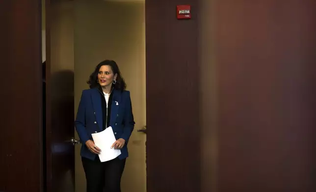 Michigan Gov. Gretchen Whitmer arrives to give a policy speech at an event on Wednesday, April 9, 2025, in Washington. (AP Photo/Mark Schiefelbein)
