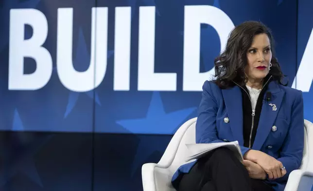 Michigan Gov. Gretchen Whitmer speaks with former television journalist Gretchen Carlson, not shown, at an event on Wednesday, April 9, 2025, in Washington. (AP Photo/Mark Schiefelbein)