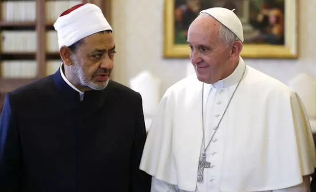 FILE - Sheikh Ahmed el-Tayeb, Grand Imam of Al-Azhar Mosque, left, talks with Pope Francis during a private audience in the Apostolic Palace, at the Vatican, Monday, May 23, 2016. "The meeting is the message.” - Meeting Sheik Ahmed el-Tayeb, the grand imam of Al-Azhar, the prestigious Sunni Muslim center of learning, after a long freeze in relations. (Max Rossi/Pool Photo via AP, File)