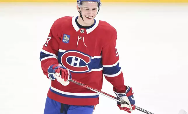 Montreal Canadiens' Ivan Demidov smiles as he skates prior to an NHL hockey game against the Chicago Blackhawks in Montreal, Monday, April 14, 2025. (Graham Hughes/The Canadian Press via AP)