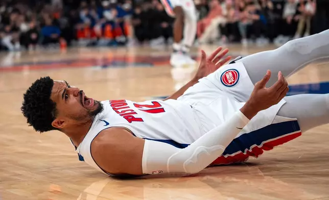 Detroit Pistons forward Tobias Harris (12) reacts as he falls to the floor during the first half of Game 2 of an NBA basketball first-round playoff series against the New York Knicks, Monday, April 21, 2025, in New York. (AP Photo/Angelina Katsanis)