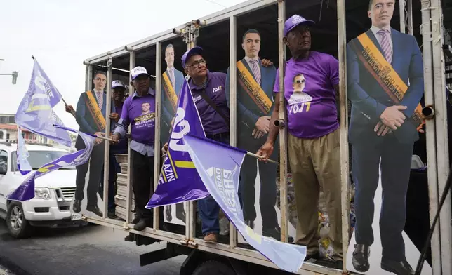 Supporters of incumbent presidential candidate Daniel Noboa prepare for his closing campaign rally in Guayaquil, Ecuador, Thursday, April 10, 2025. Ecuadoreans go to the polls on April 13 to elect a new president. (AP Photo/Fernando Vergara)