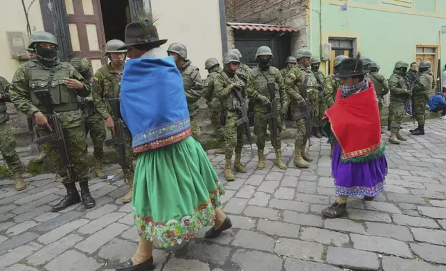 Indigenous people arrive at a rally for presidential candidate Luisa Gonzalez in Tixan, Ecuador, Sunday, March 30, 2025. (AP Photo/Dolores Ochoa)