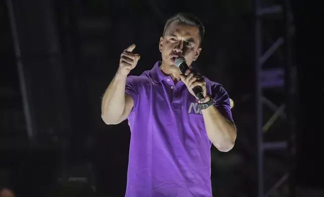 Incumbent presidential candidate Daniel Noboa speaks at a campaign rally in Quito, Ecuador, Wednesday, April 9, 2025. (AP Photo/Carlos Noriega)