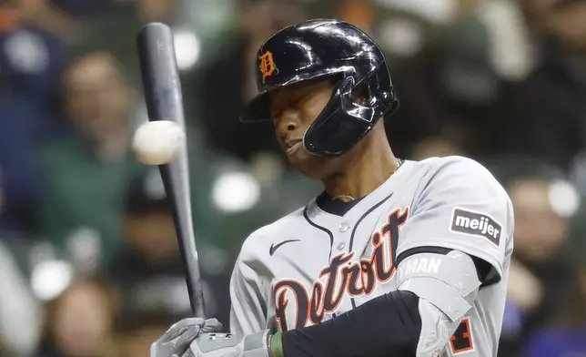 Detroit Tigers' Justyn-Henry Malloy reacts to a high and tight pitch during the fifth inning of a baseball game against the Milwaukee Brewers, Monday, April 14, 2025, in Milwaukee. (AP Photo/Jeffrey Phelps)