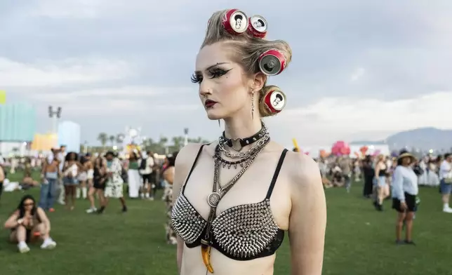 Festivalgoer Lily Bown, of Indio, poses during the first weekend of the Coachella Valley Music and Arts Festival at the Empire Polo Club on Friday, April 11, 2025, in Indio, Calif. (Photo by Amy Harris/Invision/AP)