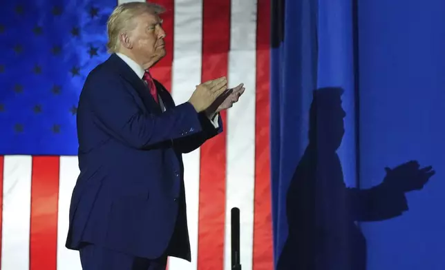President Donald Trump arrives to speak on his first 100 days at Macomb County Community College Sports Expo Center, Tuesday, April 29, 2025, in Warren, Mich. (AP Photo/Alex Brandon)