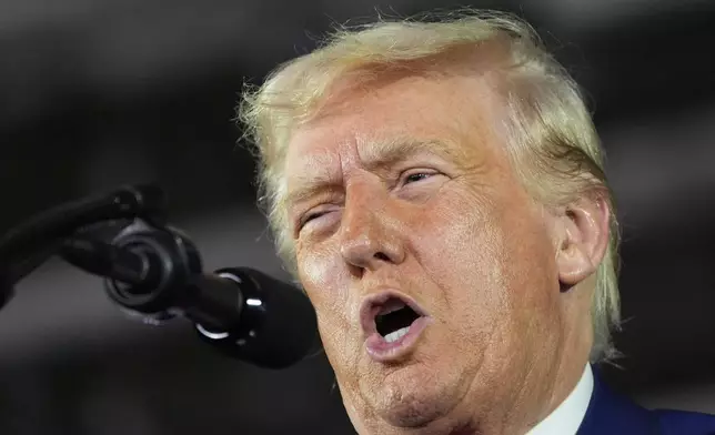 President Donald Trump speaks on his first 100 days at Macomb County Community College Sports Expo Center, Tuesday, April 29, 2025, in Warren, Mich. (AP Photo/Alex Brandon)