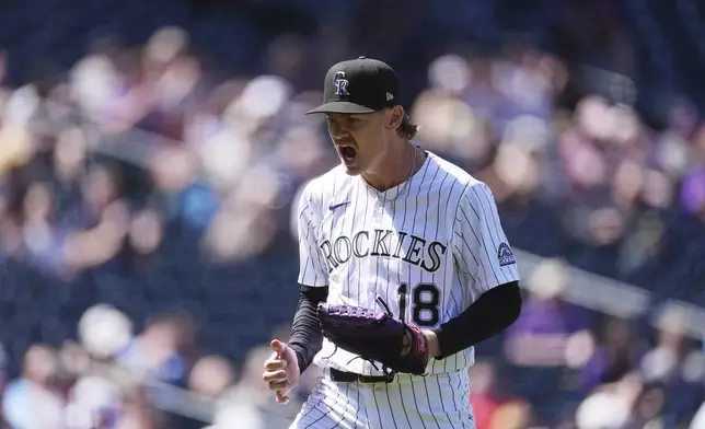 Colorado Rockies starting pitcher Ryan Feltner reacts after striking out Milwaukee Brewers' Eric Haase with the bases loaded to end the top of the fourth inning of a baseball game Thursday, April 10, 2025, in Denver. (AP Photo/David Zalubowski)