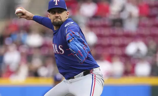 Texas Rangers' Nathan Eovaldi (17) delivers a pitch in the second inning of a baseball game against the Cincinnati Reds, Tuesday, April 1, 2025, in Cincinnati. (AP Photo/Kareem Elgazzar)