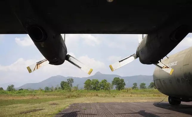 An American transport aircraft stands at the edge of the runway at the Khe Sanh Combat Base in Vietnam. Feb. 22, 2024. (AP Photo/David Rising)
