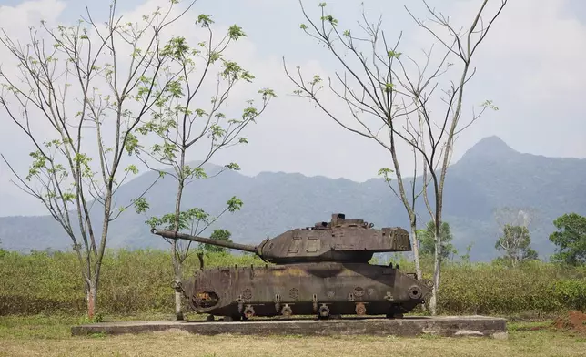 The wreckage of an American tank on display at the Khe Sanh Combat Base in Vietnam, Feb. 22, 2024. (AP Photo/David Rising)