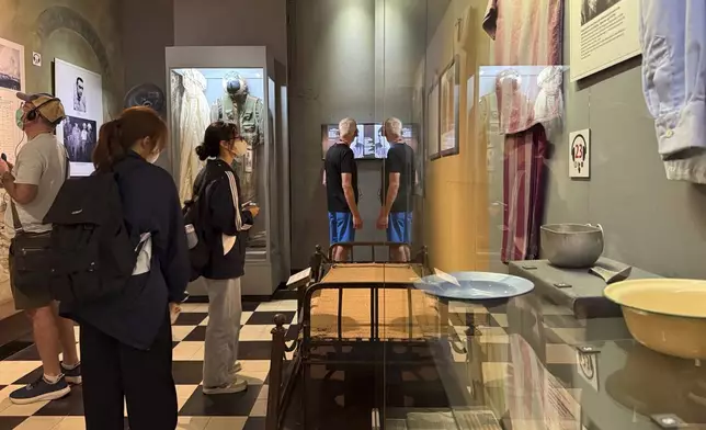 Tourists visit Hoa Lo prison museum in Hanoi, Vietnam, March 26, 2025. (AP Photo/Hau Dinh)