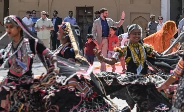 U.S. Vice President JD Vance and his sons, Vivek, left, and Ewan watch a cultural performance at Amber Fort, a historical site, in Jaipur, India, Tuesday, April 22, 2025. (Kenny Holston/The New York Times via AP, Pool)