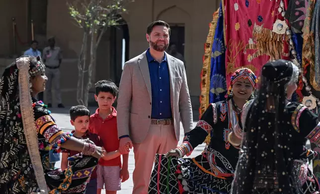 U.S. Vice President JD Vance and his sons, Vivek, left, and Ewan watch a cultural performance at Amber Fort, a historical site in Jaipur, India Tuesday, April 22, 2025. (Kenny Holston/The New York Times via AP, Pool)