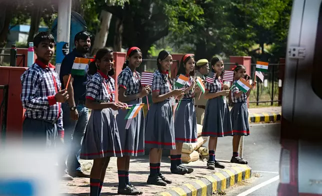 Children line the streets as U.S. Vice President JD Vance's motorcade travels through town en route to the Taj Mahal on Wednesday, April 23, 2025, in Agra, India. (Kenny Holston/The New York Times via AP, Pool)