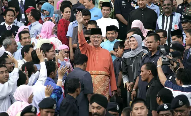 FILE - Malaysian former Prime Minister Abdullah Ahmad Badawi, center, waves as he leaves prime minister's office in Putrajaya, outside Kuala Lumpur, Malaysia, Friday, April 3, 2009. (AP Photo/Lai Seng Sin, File)