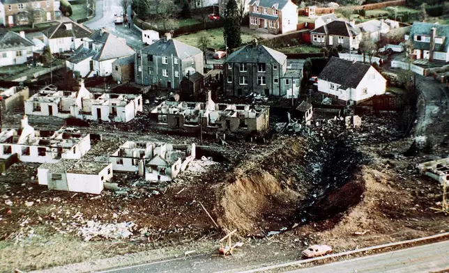 FILE - Wrecked houses and a deep gash in the ground in the village of Lockerbie, Scotland, after the bombing of the Pan Am 103 in the village of Lockerbie, Scotland, in December 1988. (AP Photo/Martin Cleaver, File)