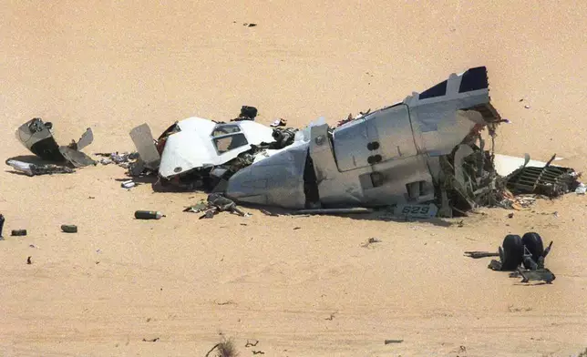 FILE - Debris of a French UTA jetliner seen in the desert of Niger, where the airliner crashed after exploding over the desert in September 1989. (AP Photo/Remy de la Mauviniere, File)