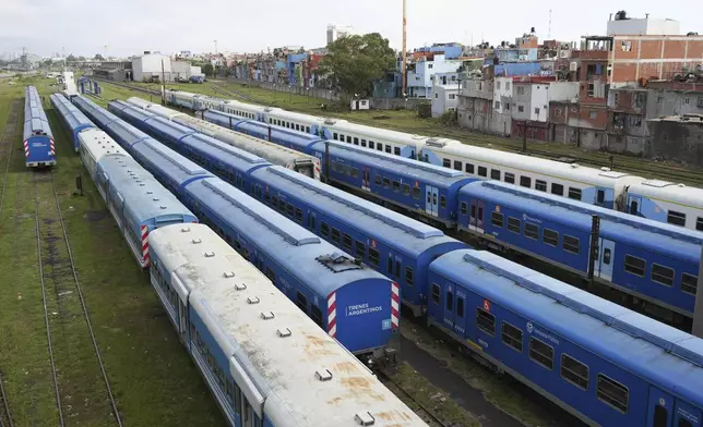 Trains stand still at the Retiro train station due to a general strike against the austerity measures of President Javier Milei in Buenos Aires, Argentina, Thursday, April 10, 2025. (AP Photo/Rodrigo Abd)