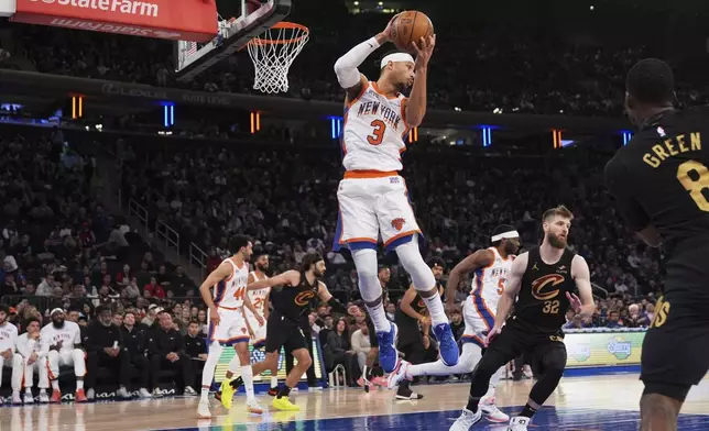 New York Knicks' Josh Hart grabs a rebound during the first half of an NBA basketball game against the Cleveland Cavaliers Friday, April 11, 2025, in New York. (AP Photo/Seth Wenig)