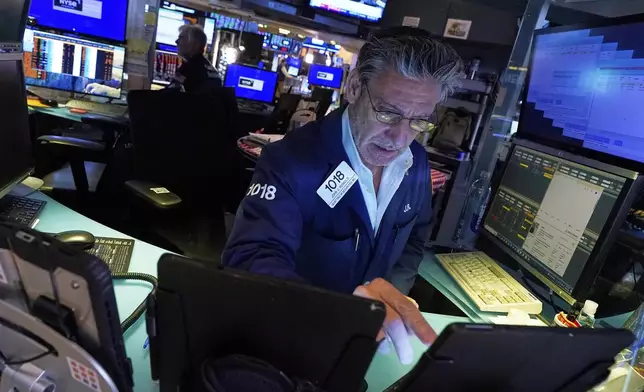Trader John Romolo works on the floor of the New York Stock Exchange, Thursday, April 24, 2025. (AP Photo/Richard Drew)