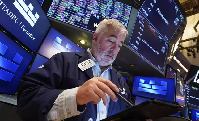 Trader Edward McCarthy works on the floor of the New York Stock Exchange, Thursday, April 24, 2025. (AP Photo/Richard Drew)