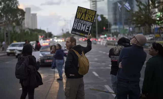 People gather in a protest demanding the immediate release of hostages held by Hamas in the Gaza Strip, during the Jewish holiday of Passover, in Tel Aviv, Israel, Saturday, April 12, 2025. (AP Photo/Leo Correa)