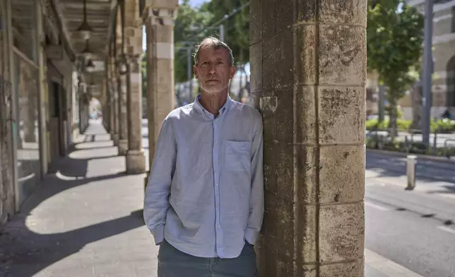 Guy Poran, a former pilot who is one of the initiators of a list of air force personnel calling for the army to focus on releasing the hostages, poses for a portrait in Tel Aviv, Wednesday, April 16, 2025. (AP Photo/Ohad Zwigenberg)