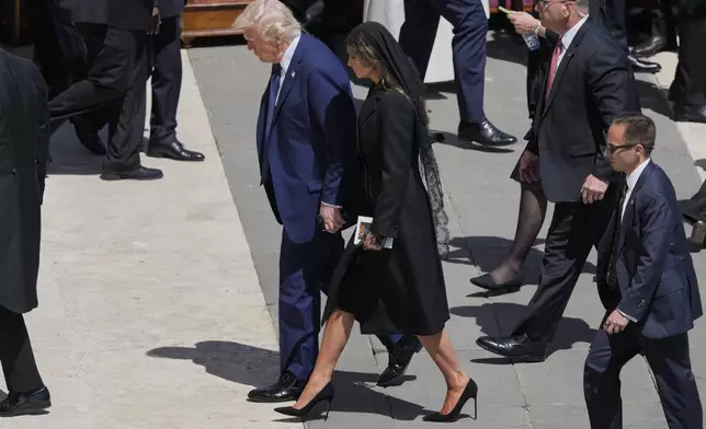 President Donald Trump and first lady Melania Trump leave at the end of the funeral of Pope Francis in St. Peter's Square at the Vatican, Saturday, April 26, 2025. (AP Photo/Gregorio Borgia)