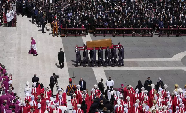 The coffin of Pope Francis is carried at the end of his funeral in St. Peter's Square at the Vatican, Saturday, April 26, 2025. (AP Photo/Gregorio Borgia)