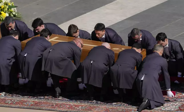 The coffin of Pope Francis is placed on the ground during his funeral in St. Peter's Square at the Vatican, Saturday, April 26, 2025. (AP Photo/Gregorio Borgia)